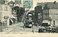 Carte postale montrant un tramway urbain de la COE sortant du Tunnel Wilbur Wright et s'engageant sur le Pont en X