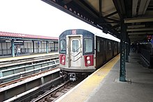 A Woodlawn-bound 4 local train made up of 10 R142 Cars leaves the Mosholu Parkway station before the last stop on the line, Woodlawn. Mosholu Parkway IRT td (2019-03-29) 04.jpg