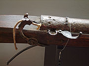 A serpentine matchlock mechanism