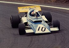 Rolf Stommelen in the Eifelland in France 1972 French Grand Prix Stommelen (5226216580).jpg