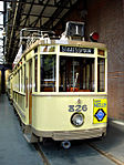 Kop van wagen 826 in de uitmonstering van lijn 1 met emaille Van Nelle theereclame.