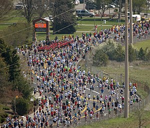 Runners head down Fort George Wright Drive dur...