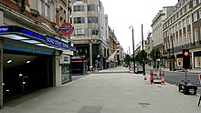Empty street outside of a London Underground station.