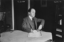 Ernest Bloch in 1917 at a table.jpg