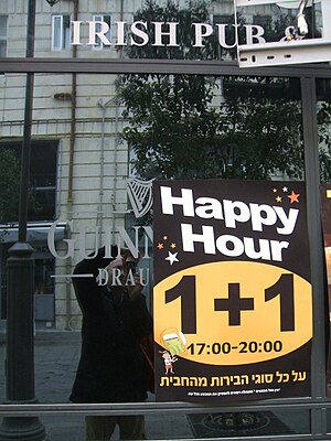 English: "Happy Hour" sign on a pub ...