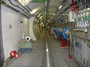 Large Hadron Collider tunnel and dipole magnets.