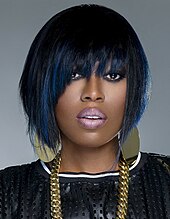 Missy Elliott looking towards the camera.