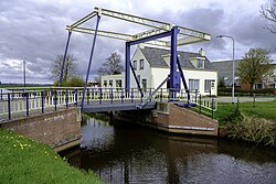 Zandumerklap over het Wolddiep. De huidige ophaalbrug (Gronings: klap) uit 2009 verving een exemplaar uit 1930. Daarvoor lag er ook al een ophaalbrug.