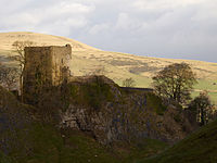 stone castle on green hill