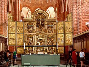 Altar in Roskilde Cathedral beneath by a carved reredos RD alter.jpg