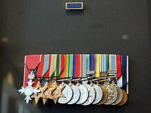 Colour photo of a group of military medals mounted on a black background