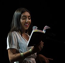 Rupi Kaur reading from her book milk and honey in Vancouver - 2017.jpg