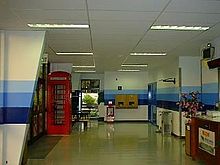 The airport passenger terminal in Diego Garcia, complete with red British telephone box. Terminal BIOT.jpg