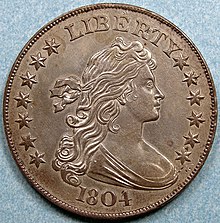 Revers d'une pièce de monnaie représentant une femme aux cheveux longs regardant vers la droite, le mot LIBERTY et la dte, 1804