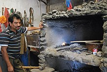 Blacksmith Apolinar Aguilar at the furnace of his blade workshop in Ocotlan de Morelos, Oaxaca, Mexico AngelAguilarOcotlan3.JPG