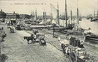 Vista del Quai Richelieu (ex quai de Bourgogne) e di Place de la Bourse intorno al 1880.