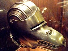 Close helmet with grotesque visor (modern reproduction of a German helmet of c. 1520 style) Close helmet with wolf-face visor, 20th century reproduction - Higgins Armory Museum - DSC05436.JPG