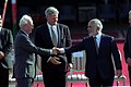 U.S. President Bill Clinton watches Jordan's King Hussein and Israeli Prime Minister Yitzhak Rabin shaking hands, October 1994