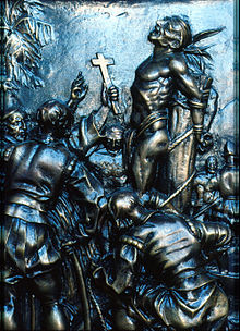 Image of a bas-relief of the portal of El Capitolio of Havana depicting the burning of Hatuey.