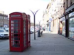 High Street, Two K6 Telephone Kiosks Adjacent To Town House