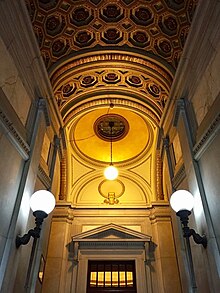 View up the main staircase, looking from the entrance vestibule toward the reading room Interior of Gould Memorial Library (Entrance).jpg