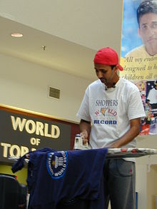 Suresh Joachim Arulanantham is an Indo-Canadian film actor and producer who has broken over 50 world records in attempts to benefit underprivileged children. He is pictured here during his successful ironing world record attempt of 2 days, 7 hours, and 5 minutes at Shoppers World Brampton. Ironing guinness 0357.JPG