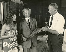 Actress Jacqueline Logan, Frederick O'Brien, and director George Melford on the set of the film Ebb Tide (1922)