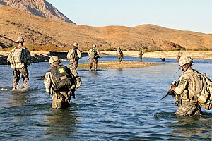 U.S Army Soldiers cross the Arghandab River to...