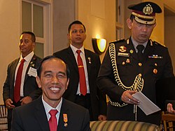 Major General Perkasa (far rear-left) when he was the Commander of the Presidential Security Force monitoring President Joko Widodo during the US-ASEAN Business Council meeting in 2015. 2015 ACF and President Jokowi 10-26-121 (cropped).jpg