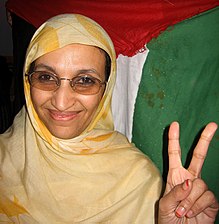 Aminatou Haidar making a "V-for-victory" sign