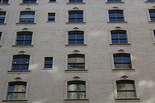 Windows on the brick facade of the upper stories Belnord NYC Jun 2022 09.jpg