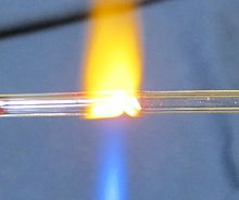 The welding together of two tubes made from lead glass Glass welding two tubes together.JPG