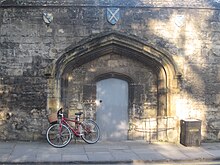 15th century gateway of Gloucester College bearing the arms of the abbeys of Winchcombe, St Albans and Ramsey Worcester College, Oxford archway.JPG