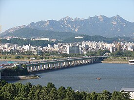 Yanghwa Bridge, facing north. Bukhansan is in the background