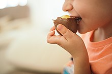 Familiarity with the flavor of chocolate is one example of knowledge by acquaintance, which belongs to non-declarative knowledge. Young boy eating chocolate egg.jpg