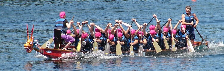 A dragon boat moving across the Danube river in Budapest, Hungary