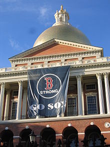 The Massachusetts State House displaying a banner in honor of the Red Sox's 2013 World Series appearance. "B Strong" was a patch worn by the Red Sox in memory of Boston Marathon bombing victims. Massachusetts State House Red Sox Banner.JPG