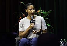 Moore speaking before at The Marshall Project in Washington, D.C. in 2019. Maya Moore speaking at The Marshall Project in Washington DC (48751108303).jpg