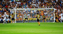 Player trying to head the ball into the goal