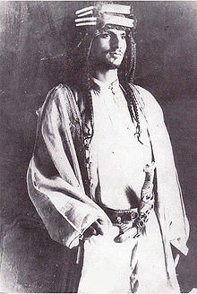 Saud bin Abdul Aziz, eldest son of Abdul Aziz Al-Saud (Ibn Saud) and second King of Saudi Arabia. After spending his early life as a fighter in his father's forces, Saud inherited the Saudi throne in 1953 and changed the state's succession laws to favor direct primogeniture from father to son as opposed to Salic law. After years of internal conflict, he was deposed in 1964 by members of the Saudi clergy and the House of Saud; he was replaced with his half-brother Faisal ibn Abdul Aziz Al-Saud.