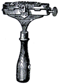 Cross-hatched illustration of a type-holder.