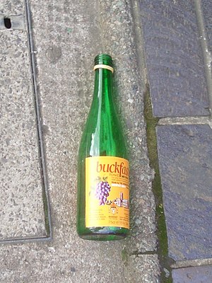A bottle of Buckfast in the street. Buckfast's...