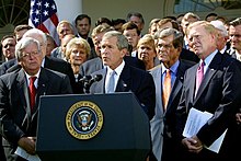 President George Bush, surrounded by leaders of the House and Senate, announces the Joint Resolution to Authorize the Use of United States Armed Forces Against Iraq, 2 October 2002. Bush auth jbc.jpg