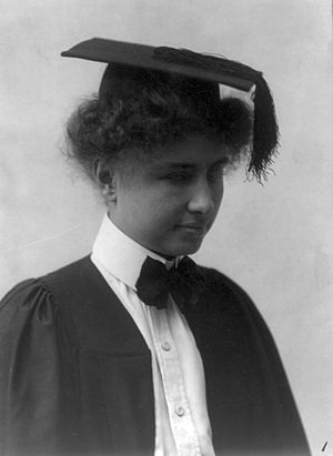 Helen Keller wearing graduation cap and gown. ...
