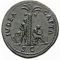 Sesterce de Vespasien (vers 71 apr. J.-C.). Homme debout les mains liées dans le dos, sous un palmier où la Judée assise pleure. Inscription : Iudea capta (« Judée conquise »).