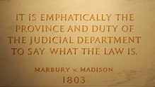 Inscription on the wall of the Supreme Court Building from Marbury v. Madison, in which Chief Justice John Marshall outlined the concept of judicial review Marbury v Madison John Marshall by Swatjester crop.jpg