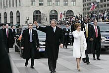 George and Laura Bush during the 2005 Inaugural Parade President George W. Bush and Mrs. Laura Bush Lead the Inaugural Parade down Pennsylvania Avenue en Route the White House.jpg