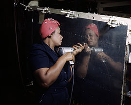 "Rosie the Riveter", working on an A-31 "Vengeance" dive bomber, Tennessee, 1943. Rosie the Riveter (Vultee) DS.jpg