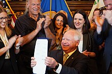 Governor Tim Walz celebrates the signing of House File 100 to legalize recreational cannabis in Minnesota with lawmakers and former governor Jesse Ventura (May 2023) Tim Walz Jesse Ventura cannabis bill.jpg