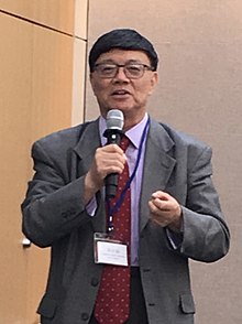 Yongyi Song Speaking at a Conference